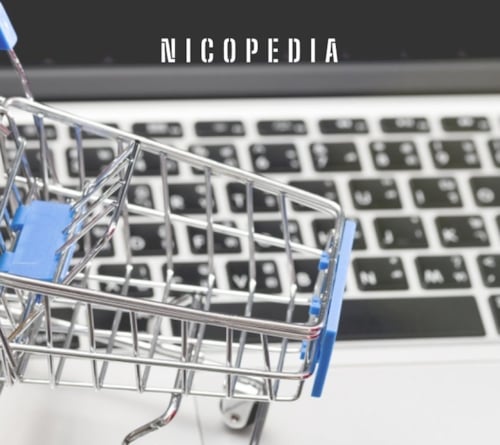 image of a shopping trolley next to a computer keyboard, indicating importance of online access to nicotine products