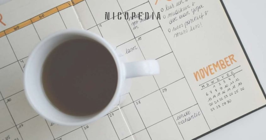 Coffee cup on a calendar, indicating planning ahead for smokefree success