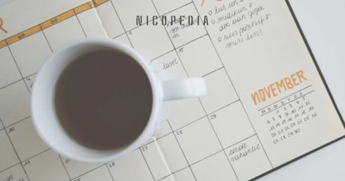 Coffee cup on a calendar, indicating planning ahead for smokefree success