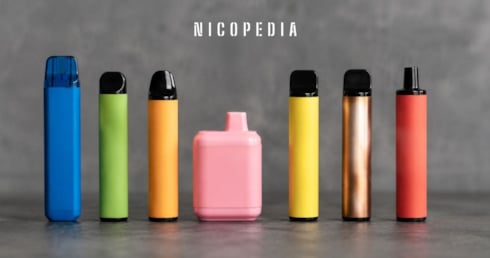 7 colourful vapes lined up against a grey background